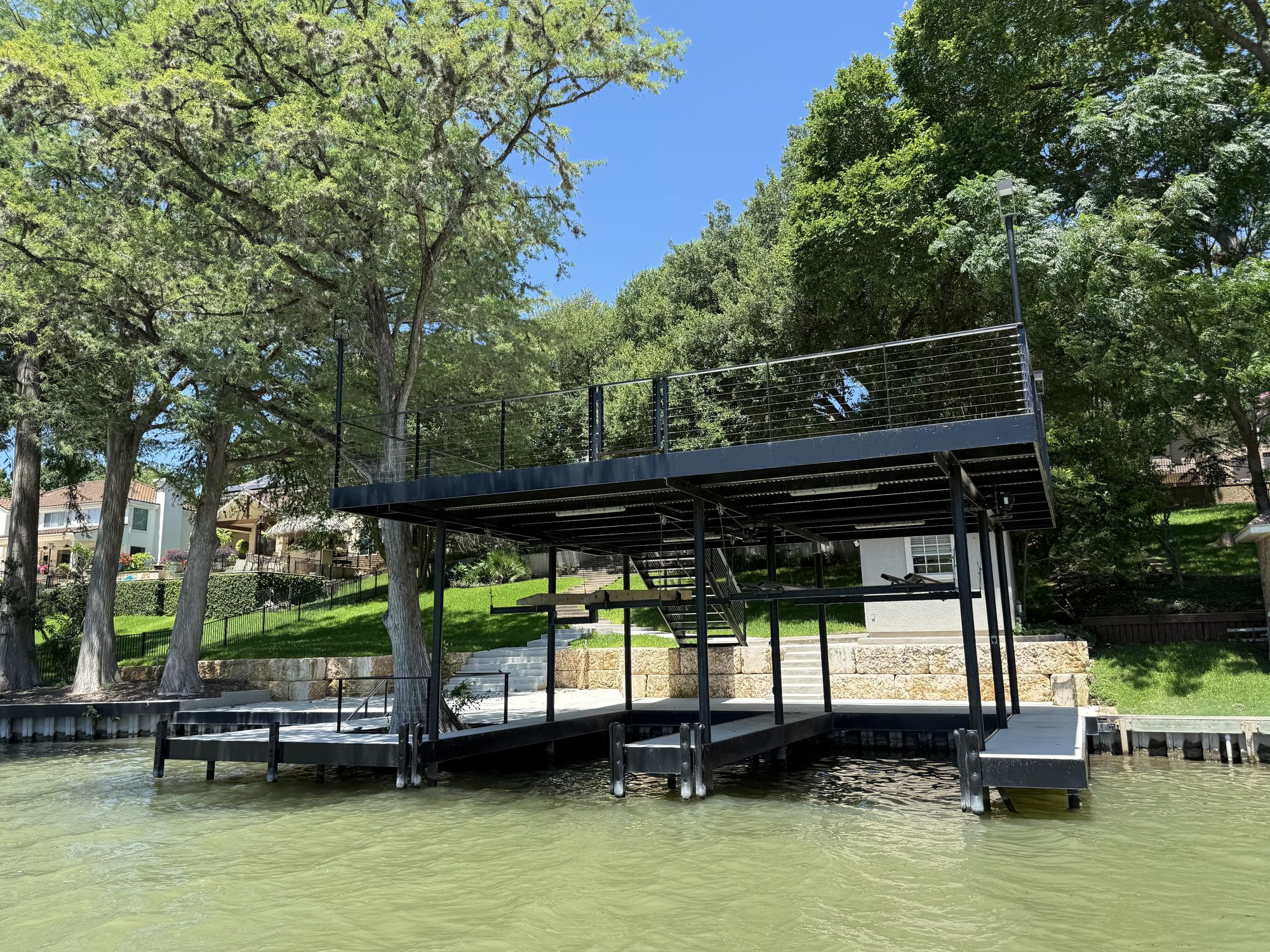 Boathouse, dock, bulkhead, and retaining wall on a Lake Dunlap waterfront by Waterfront Unlimited