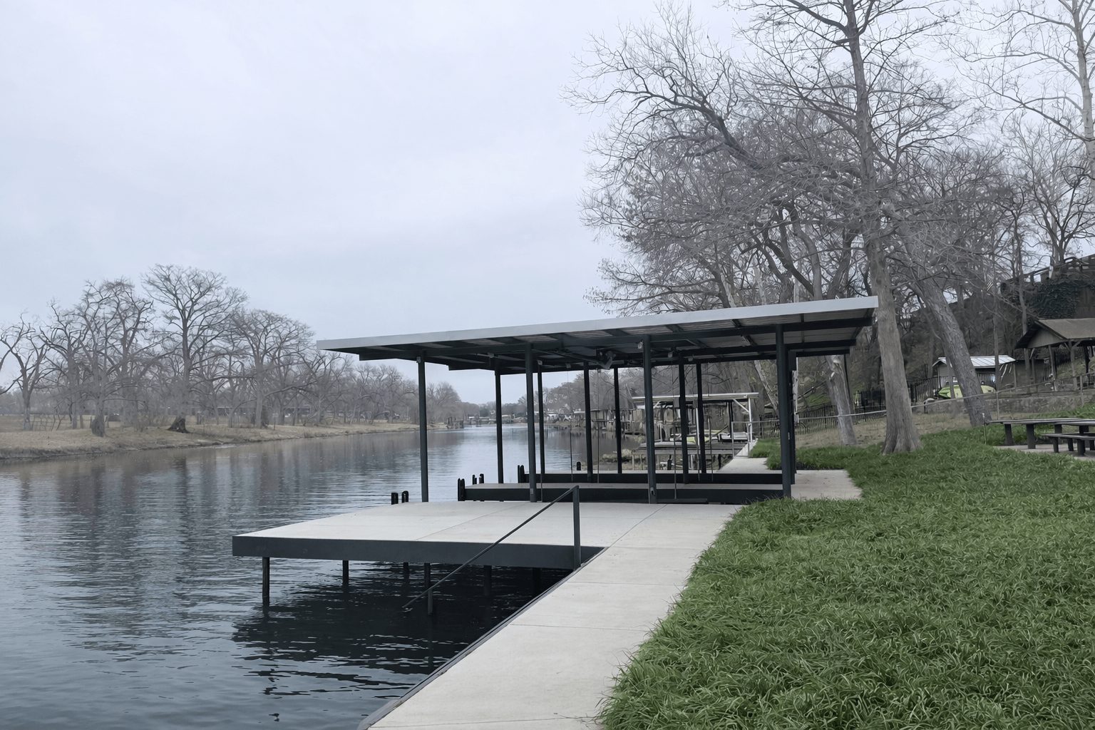 Southside drawdown build on Lake McQueeney: double boathouse with over 300 feet of CLOC vinyl bulkhead by Waterfront Unlimited