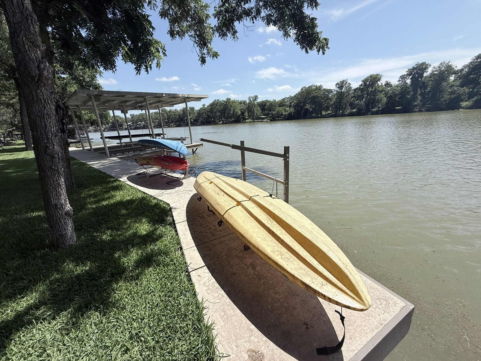 Double boathouse, boatlift, dock, and CLOC vinyl bulkhead on Lake Placid by Waterfront Unlimited