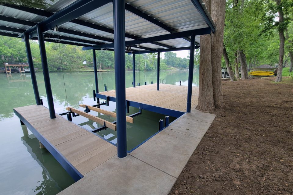 Steel boathouse with boatlift on Lake Dunlap